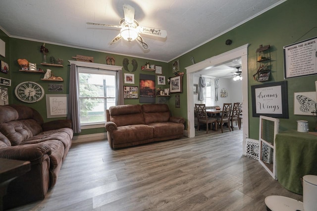 375 S Bridge St, Markesan, WI 53946 - living area with ceiling fan, crown molding, plenty of natural light, and wood finished floors