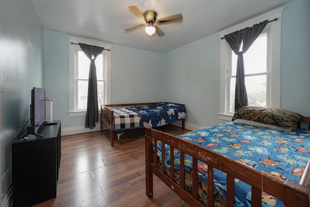 375 S Bridge St, Markesan, WI 53946 - bedroom with wood finished floors, baseboards, and ceiling fan