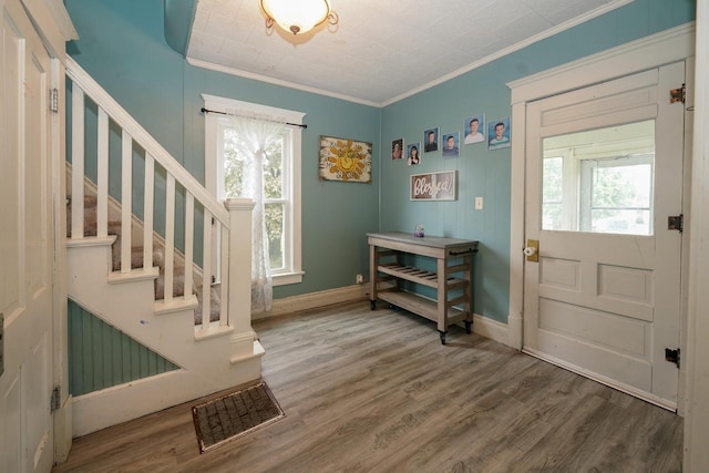 375 S Bridge St, Markesan, WI 53946 - foyer entrance featuring wood finished floors, crown molding, stairway, and baseboards