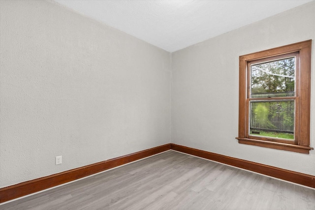 3046 N 57th St, Milwaukee, WI 53210 - spare room featuring wood finished floors and baseboards