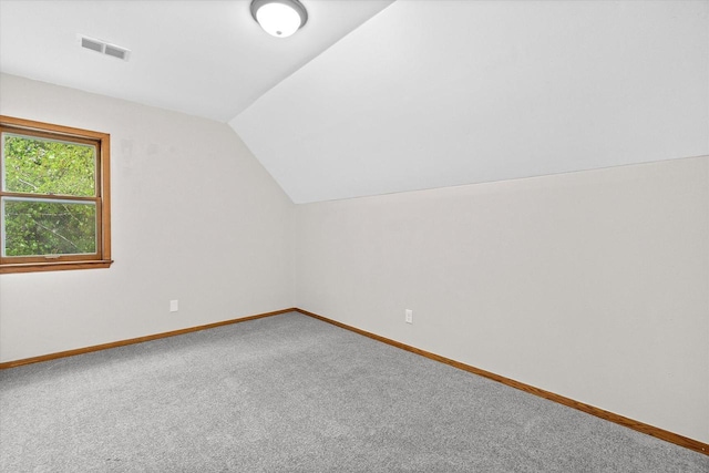 3046 N 57th St, Milwaukee, WI 53210 - bonus room with lofted ceiling, carpet flooring, and baseboards