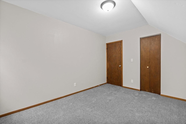 3046 N 57th St, Milwaukee, WI 53210 - unfurnished bedroom featuring carpet flooring, lofted ceiling, and baseboards