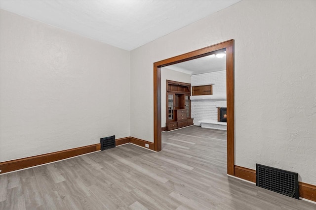 3046 N 57th St, Milwaukee, WI 53210 - unfurnished room featuring wood finished floors, baseboards, and a textured wall