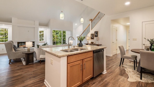 2725 Hidden Dr, Saint Francis, WI 53235 - kitchen with dishwasher, a sink, dark wood-type flooring, decorative light fixtures, and an island with sink