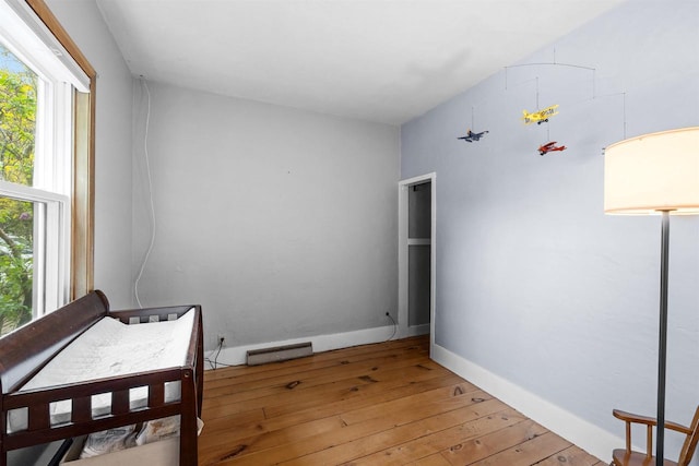 E3722 County Road Ee, Waupaca, WI 54981 - bedroom featuring light wood finished floors and baseboards