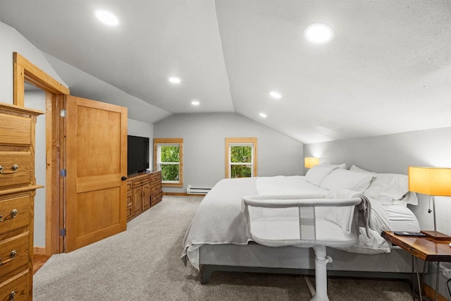 E3722 County Road Ee, Waupaca, WI 54981 - bedroom featuring vaulted ceiling, baseboard heating, recessed lighting, and light colored carpet