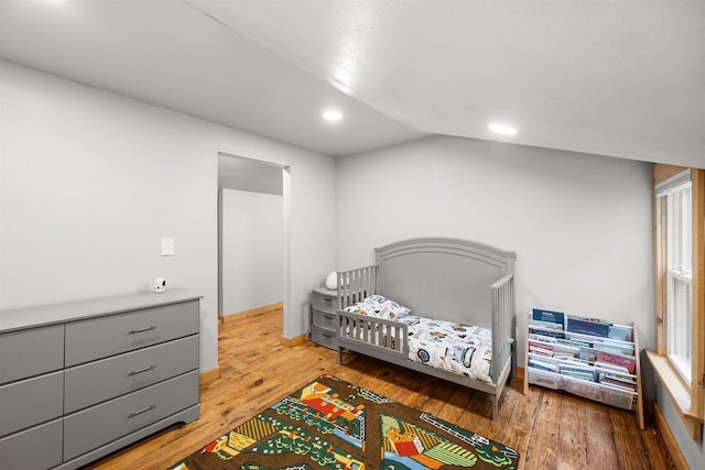 E3722 County Road Ee, Waupaca, WI 54981 - bedroom featuring hardwood / wood-style flooring, lofted ceiling, and recessed lighting