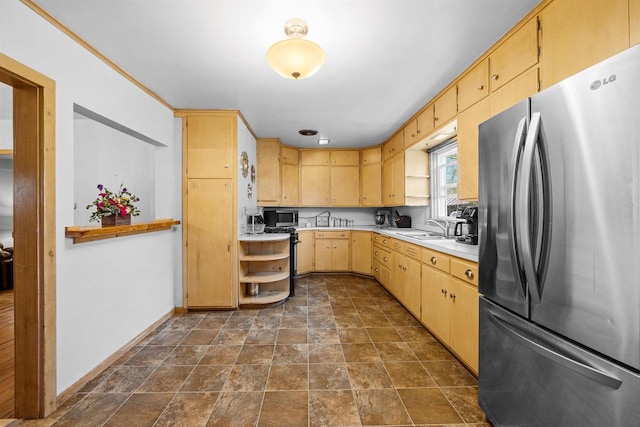 E3722 County Road Ee, Waupaca, WI 54981 - kitchen featuring appliances with stainless steel finishes, light countertops, a sink, light brown cabinets, and stone finish flooring