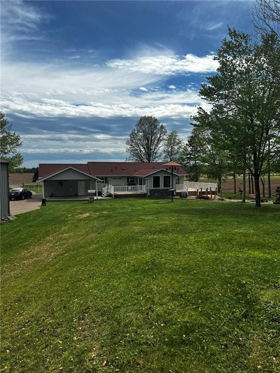 10384 W County Line Rd, Exeland, WI 54835 - rear view of property featuring a yard and a wooden deck