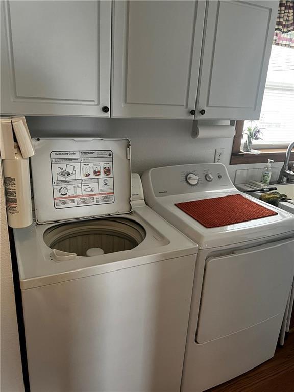 10384 W County Line Rd, Exeland, WI 54835 - laundry area featuring washing machine and dryer and dark wood-style flooring
