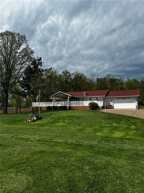 10384 W County Line Rd, Exeland, WI 54835 - view of home's community featuring an attached garage, a yard, and concrete driveway
