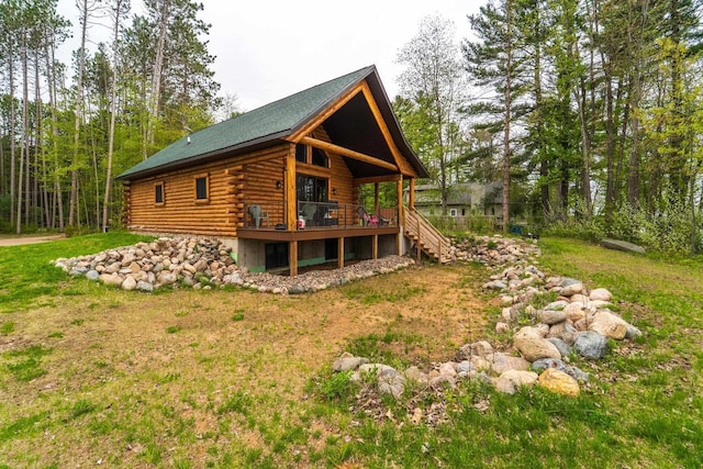 N11594 Woodland Dr, Tomahawk, WI 54487 - view of side of property featuring log exterior, a wooden deck, and stairway