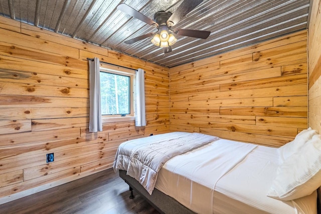 N11594 Woodland Dr, Tomahawk, WI 54487 - bedroom with wood walls, dark wood finished floors, and a ceiling fan