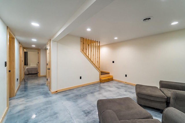 N11594 Woodland Dr, Tomahawk, WI 54487 - living room featuring baseboards, recessed lighting, stairway, and finished concrete flooring