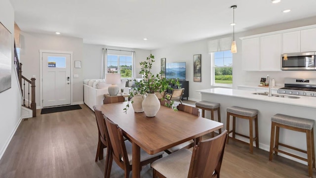505 Oak Opening Dr, Stoughton, WI 53589 - dining area with recessed lighting, light wood finished floors, and stairway