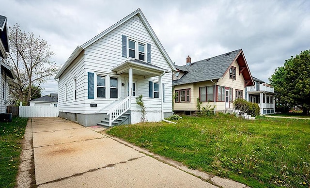 3834 Sheridan Rd, Kenosha, WI 53140 - view of front of home with a front yard and central air condition unit