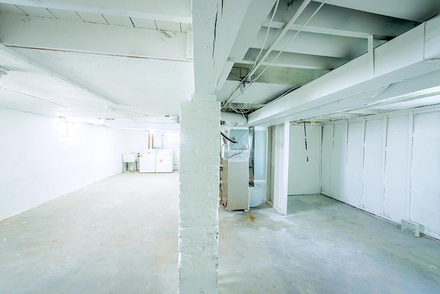 3834 Sheridan Rd, Kenosha, WI 53140 - basement featuring washer / dryer, heating unit, a sink, and plenty of natural light