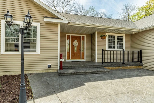 220 Grove St, Ridgeway, WI 53582 - doorway to property featuring covered porch and a shingled roof
