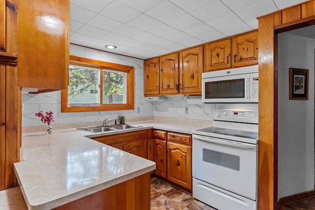 2901 W Forest Hill Ave, Franklin, WI 53132 - kitchen featuring white appliances, a sink, a peninsula, and brown cabinetry
