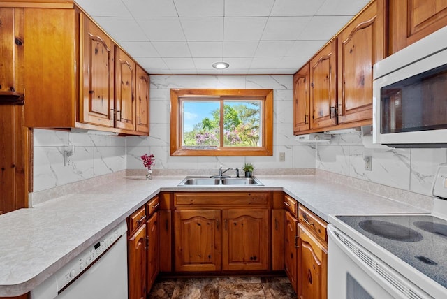 2901 W Forest Hill Ave, Franklin, WI 53132 - kitchen featuring white appliances, a sink, brown cabinetry, and tasteful backsplash