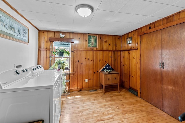 2901 W Forest Hill Ave, Franklin, WI 53132 - laundry area with light wood-type flooring, separate washer and dryer, and wood walls