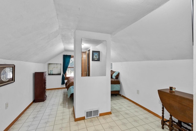 2901 W Forest Hill Ave, Franklin, WI 53132 - bonus room featuring lofted ceiling, baseboards, light flooring, and a textured ceiling