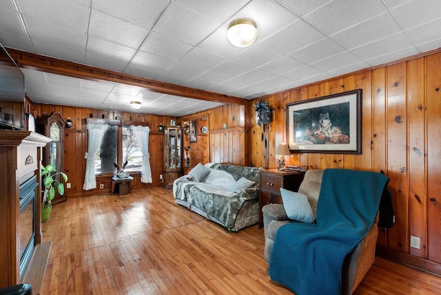 2901 W Forest Hill Ave, Franklin, WI 53132 - living room with wood walls, hardwood / wood-style flooring, and a glass covered fireplace
