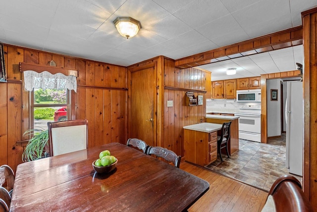 2901 W Forest Hill Ave, Franklin, WI 53132 - dining space with wooden walls and light wood-style flooring