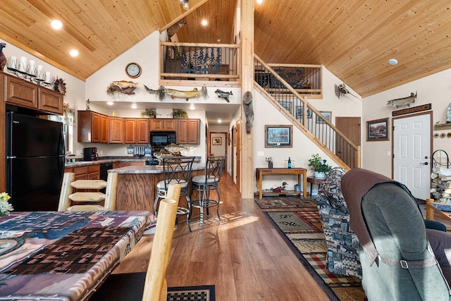 W6554 Wolf Lake Rd, Wausaukee, WI 54177 - dining area featuring high vaulted ceiling, wooden ceiling, wood finished floors, stairway, and recessed lighting