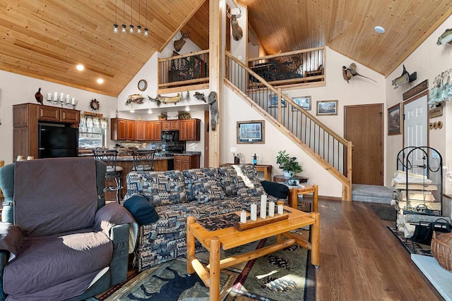 W6554 Wolf Lake Rd, Wausaukee, WI 54177 - living room featuring wood ceiling, dark wood-style flooring, high vaulted ceiling, stairs, and recessed lighting