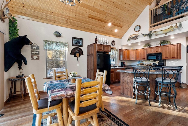 W6554 Wolf Lake Rd, Wausaukee, WI 54177 - dining area featuring wooden ceiling, light wood-style flooring, and high vaulted ceiling
