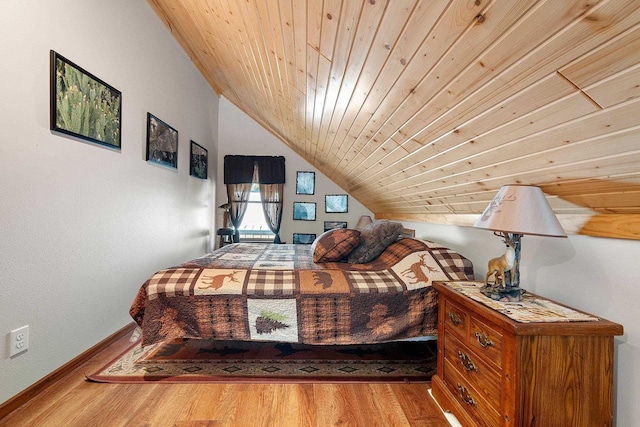 W6554 Wolf Lake Rd, Wausaukee, WI 54177 - bedroom featuring lofted ceiling, wood finished floors, baseboards, and wood ceiling