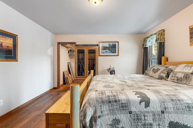 W6554 Wolf Lake Rd, Wausaukee, WI 54177 - bedroom with wood finished floors and baseboards