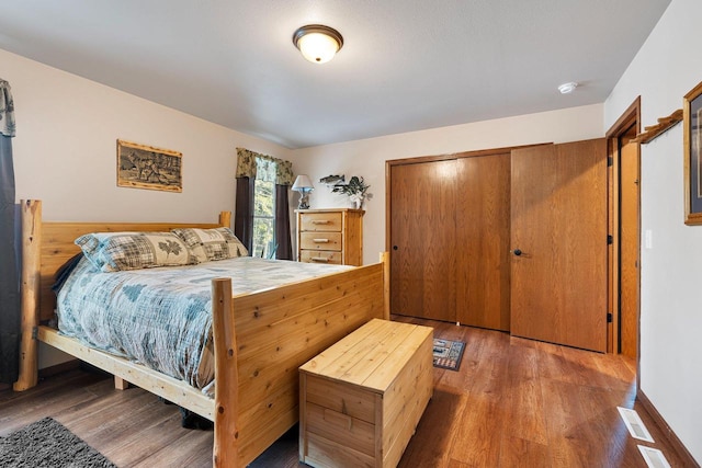W6554 Wolf Lake Rd, Wausaukee, WI 54177 - bedroom featuring wood finished floors and a closet