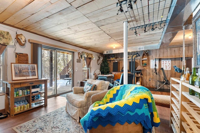 W6554 Wolf Lake Rd, Wausaukee, WI 54177 - living area with wood finished floors, wooden walls, and wood ceiling