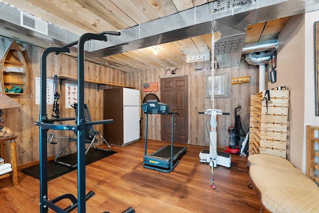 W6554 Wolf Lake Rd, Wausaukee, WI 54177 - workout area with wood finished floors and wooden walls