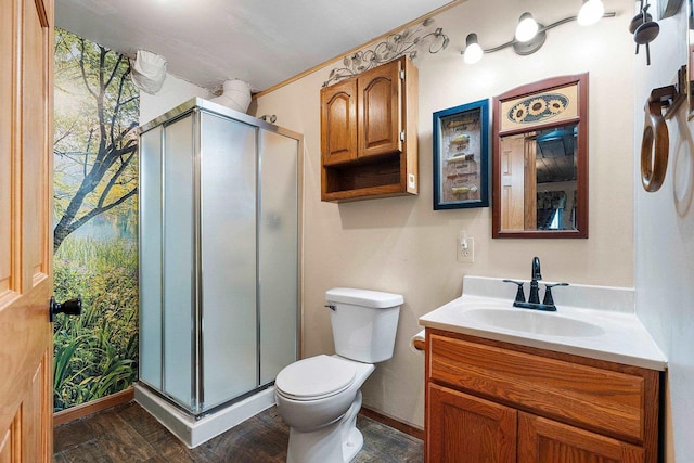 W6554 Wolf Lake Rd, Wausaukee, WI 54177 - full bathroom with vanity, toilet, a shower stall, wood finished floors, and baseboards