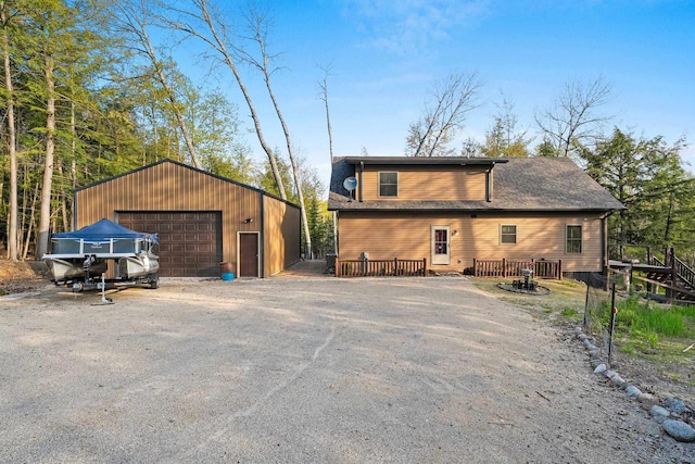 W6554 Wolf Lake Rd, Wausaukee, WI 54177 - view of front of house featuring a garage and an outdoor structure