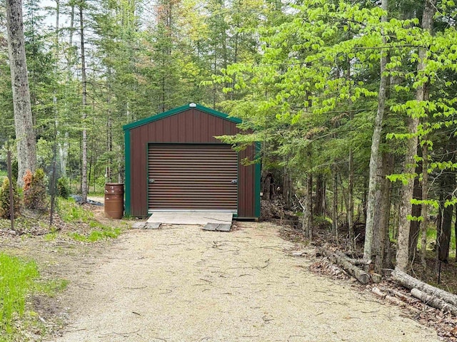 W6554 Wolf Lake Rd, Wausaukee, WI 54177 - view of outdoor structure with a forest view and dirt driveway