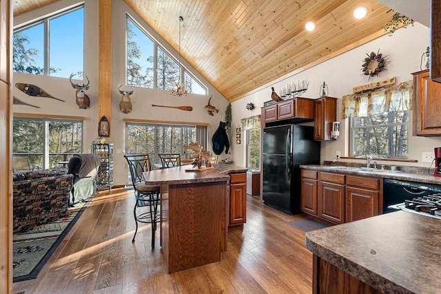 W6554 Wolf Lake Rd, Wausaukee, WI 54177 - kitchen with black appliances, wooden ceiling, a sink, dark countertops, and high vaulted ceiling
