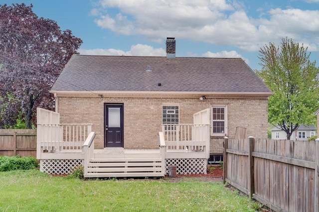 1904 75th St, Kenosha, WI 53143 - rear view of house with a wooden deck, a chimney, and roof with shingles