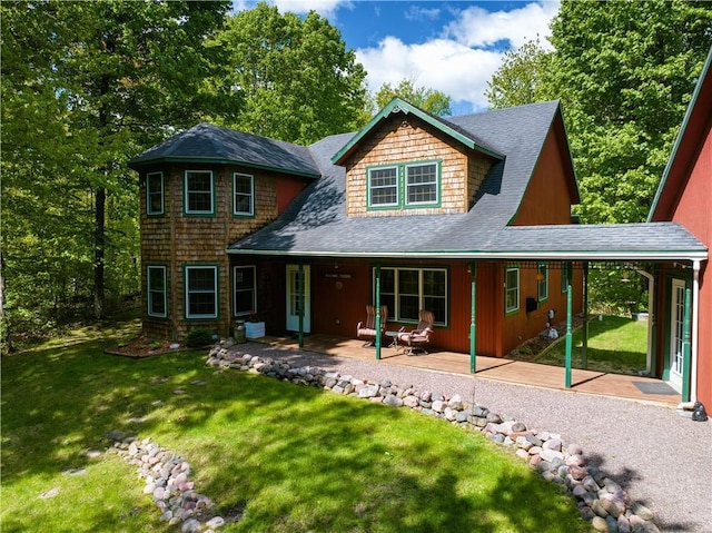 2706 28 1/8 St, Birchwood, WI 54817 - view of front facade with roof with shingles, a front yard, and a patio