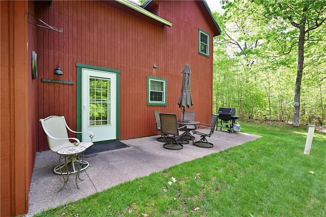 2706 28 1/8 St, Birchwood, WI 54817 - back of property featuring a lawn and a patio