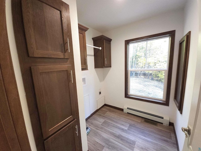 37375 E Bresette Hill Rd, Bayfield, WI 54814 - washroom with hookup for an electric dryer, baseboard heating, cabinet space, wood finished floors, and baseboards
