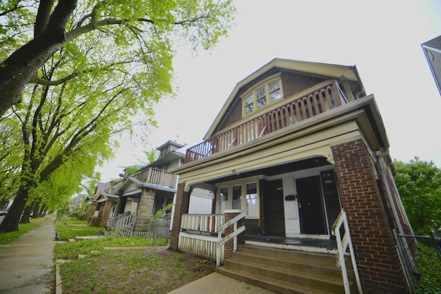 2435 N 44th St Unit 2437, Milwaukee, WI 53210 - view of front of home with a balcony, covered porch, and brick siding