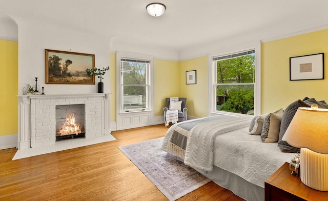 2724 N Shepard Ave, Milwaukee, WI 53211 - bedroom with wood finished floors and a brick fireplace