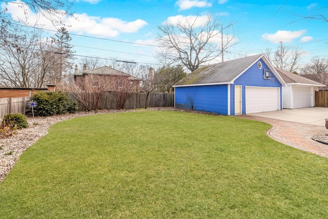 2724 N Shepard Ave, Milwaukee, WI 53211 - view of yard featuring an outdoor structure, a garage, and driveway
