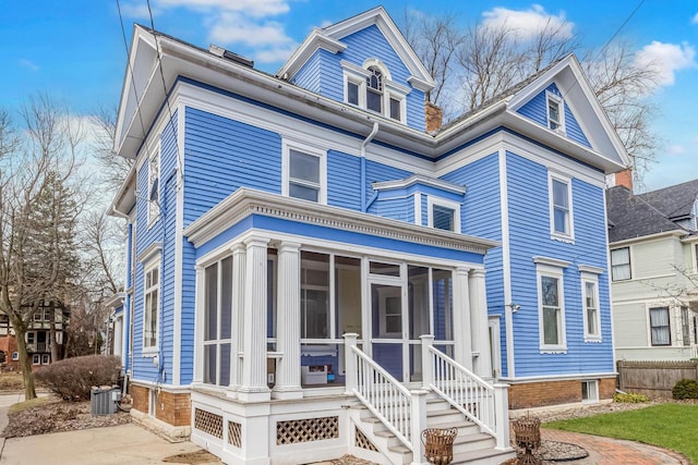2724 N Shepard Ave, Milwaukee, WI 53211 - view of front facade featuring a sunroom and central air condition unit