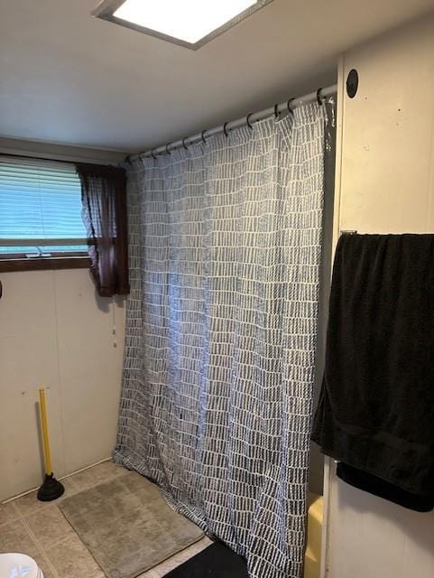 218 Meade Ave, Black River Falls, WI 54615 - bathroom with shower / bath combo and tile patterned flooring