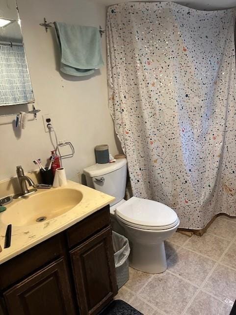 218 Meade Ave, Black River Falls, WI 54615 - full bath with tile patterned floors, vanity, toilet, and curtained shower